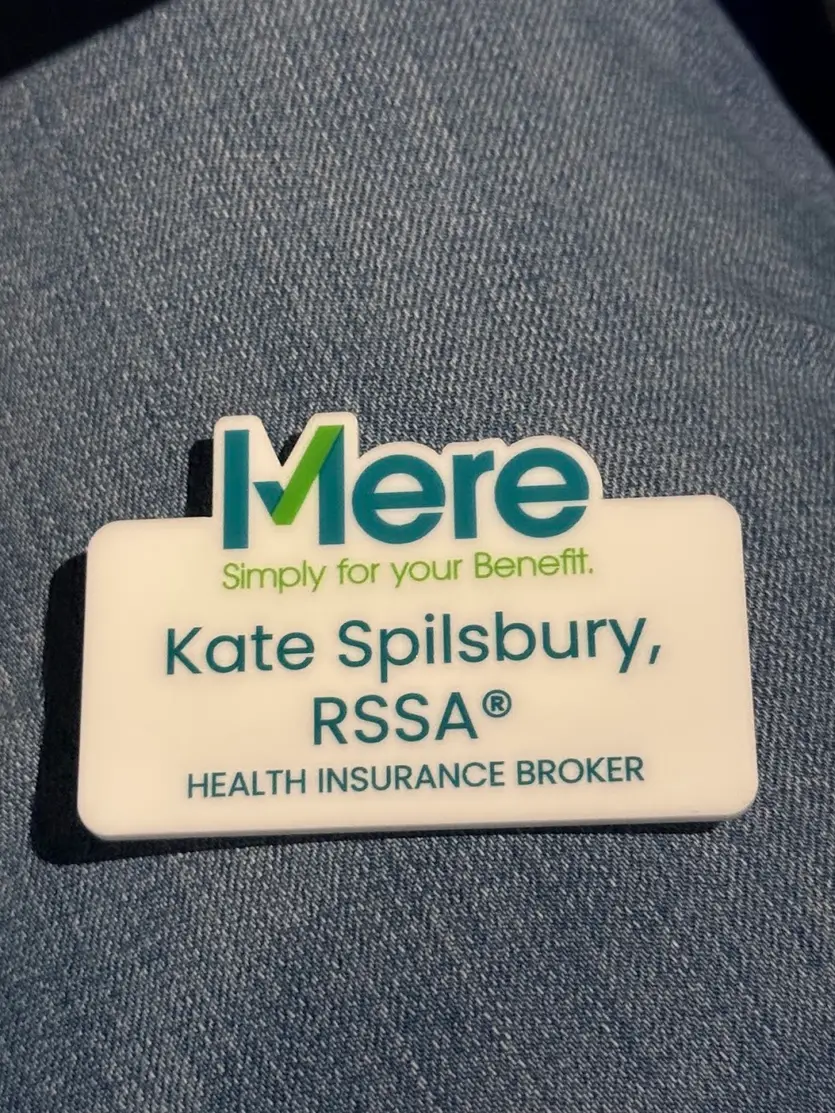 Name badge reading Kate Spilsbury, RSSA, Health Insurance Broker, Mere Benefits