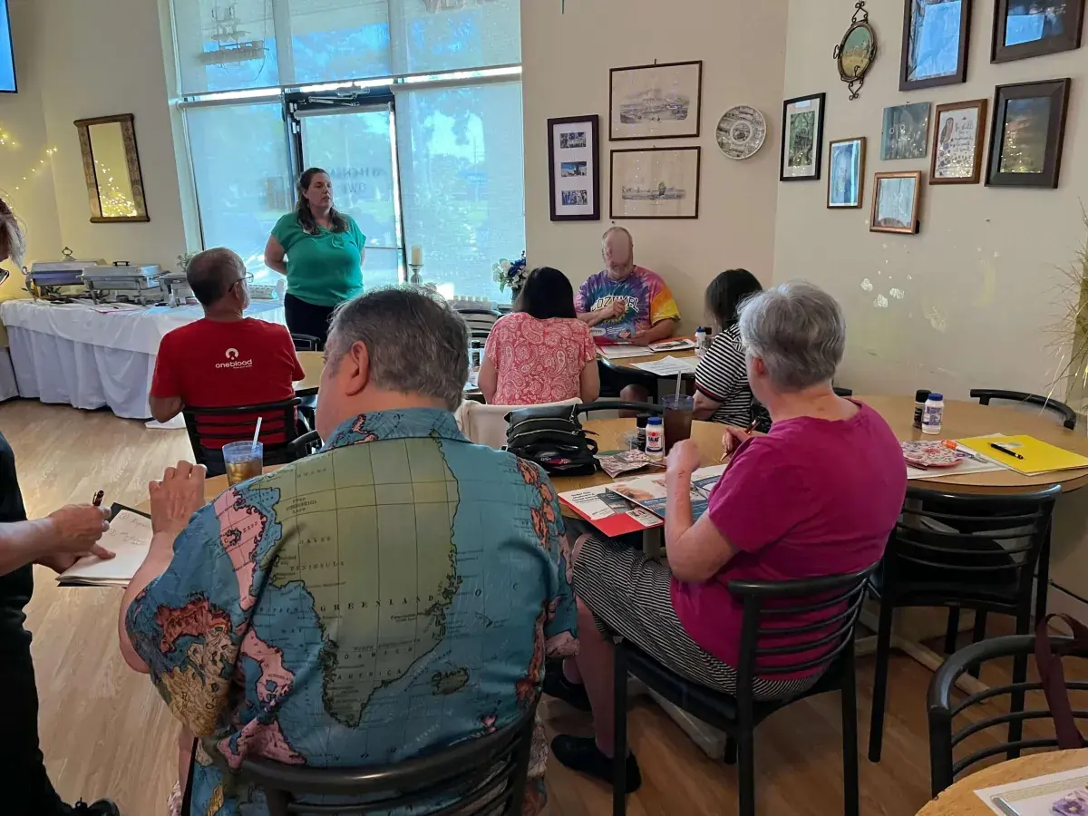 Kate Spilsbury presenting a Medicare education session to a seated audience